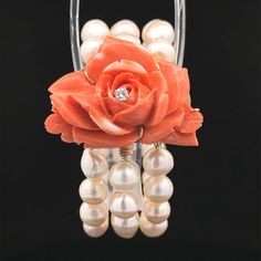 --Stone(s):-- (54) Genuine Cultured Pearls - Baroque Shape - Strung - White Color w/ Pink Overtones - Nice Luster - 9mm each (approx.) (1) Natural Genuine Diamond - Round Brilliant Cut - Prong Set - Nice White Color - 0.16ctw (approx.) (1) Natural Genuine Coral - Carved Flower Shape - Prong Set - Very Detailed - Orangy Pink Color w/ White Spots - 44.6x32.3mm (approx.) Material: String w/ Solid 13-14K Yellow Gold Bars & Clasp Weight: 74.28 Grams Type: 3-Row Cultured Pearls w/ Carved Coral Yellow Gold Bar, Cultured Pearls, Flower Shape, Pearl Bracelet, Prong Setting, White Color, Pink Color, Jewelry Bracelets, Coral