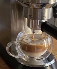 coffee being poured into a glass cup