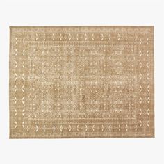 a beige rug with an intricate design on the top and bottom, it is made out of