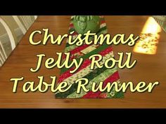 christmas jelly roll table runner on a dining room table with the words christmas jelly roll table runner