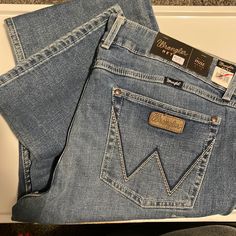 Wrangler Retro Bootcut -Mae Mid-Rise -19x34 Western Style Blue Jeans For Rodeo, Light Wash Denim Jeans For Rodeo, Western Style Light Wash Denim Jeans, Western Jeans Womens, Wrangler Bootcut Jeans, Wrangler Jeans Women's, Riding Jeans, Western Wear Outfits, Dark Wash Bootcut Jeans