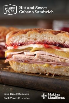 a close up of a sandwich on a cutting board with the words hot and sweet cuban sandwich