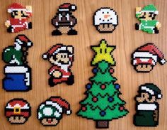 pixelated christmas ornaments are arranged on a wooden surface