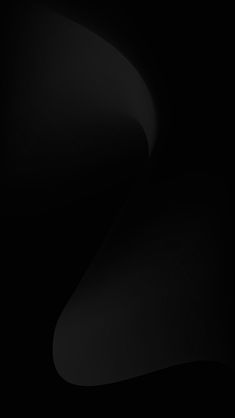 an abstract black and white background with curved curves in the center, on a dark surface