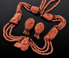 "Stunning Chinese export salmon coral sterling necklace and earrings set C 1920. 5 salmon coral plaques are prong set in custom made sterling frames. The plaques are meticulously hand carved with centuries old traditional Chinese fruit and leaves motif. They are connected with 3 swags of strung coral beads. The back of the necklace has 2 swags. The necklace is 17\" around neck. Front plaque measures 1\" X 7/8\" The 2 middle plaques are approx. 1 1/8\" long, the 2 top ones are approx. 3/4\" long. Chinese Fruit, Coral Jewelry Set, Phoenix Jewelry, Miriam Haskell Jewelry, Abstract Jewelry, Vintage Jewelry Sets, Art Earrings, Chinese Export, Sterling Necklaces