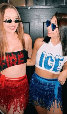 two young women wearing red, white and blue skirts posing for the camera with their arms around each other