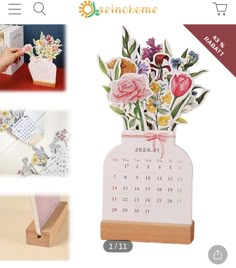 a desktop calendar with flowers in a vase on the front, and an image of a hand holding a card