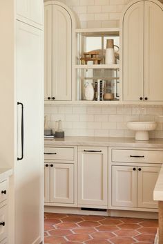 the kitchen is clean and ready for us to use it's white cabinetry