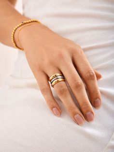 Unleash your bold side with the Moxie Ring. An extra long statement piece, this ring is gorgeously gold with a sliver of silver to create some mixed metal magic. Perfect for stacking or shining solo, the Moxie Ring adds a dash of daring to any look. Metal Magic, Mixed Metal Ring, Mixed Metal Rings, Ring Styles, Mixed Metal Jewelry, Opal Ring Gold, Stacking Ring Set, Jewels Rings, Evil Eye Ring