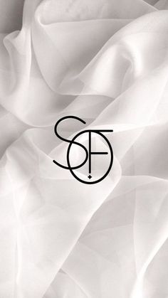 the letter s is surrounded by white fabric