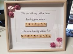 a wooden scrabble frame with flowers on it