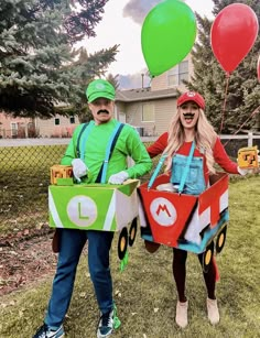 two people dressed up as mario and luigi from mario kart are standing in the grass