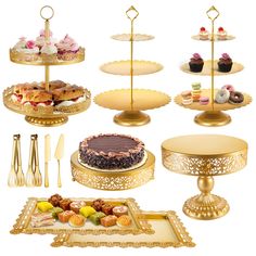 an assortment of desserts and pastries displayed on gold serving trays