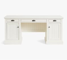 a white desk with two doors and drawers