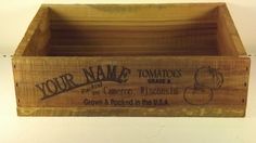 a wooden crate with the name your name tomatoes on it and an apple in the bottom