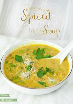 a white bowl filled with soup on top of a table