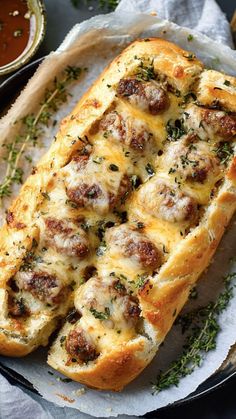 sausage and cheese bread on a plate with dipping sauces