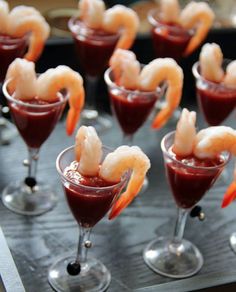 an image of food in glasses with shrimp on top