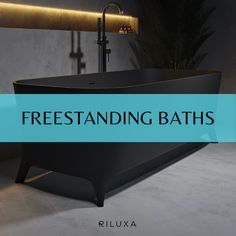 a bathtub with the words freestanding baths on it in front of a plant