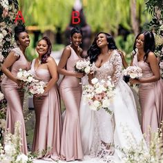 a group of women standing next to each other in front of a flower covered arch