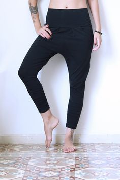 Black Joggers, Yoga pants, Drop Crotch Pants, Loose Pants, Indie pants, Women Joggers - Amazing Pants!  Made from soft light cotton-Lycra fabric. with inside pockets, and fabric belt that can be folded. These pants are a little low cut in the groin, and become tight on the legs shin with little rubber stitched inside that make the legs part a nice ruffle look. Great for yoga or anywhere else, I wear them a lot, they are so comfortable and pleasant:)  ✦ Color >> Black ✦ Fabric: Cotton Laycra  ✦ M Stretch Tapered Leg Yoga Pants, Black High-waisted Yoga Bottoms, Stretch High-waisted Harem Pants For Loungewear, Stretch Black Harem Pants For Loungewear, Black Stretch Harem Pants For Loungewear, High Waist Baggy Yoga Bottoms, High Waist Baggy Bottoms For Yoga, Baggy High Waist Bottoms For Yoga, Stretch Tapered Leg Bottoms For Yoga