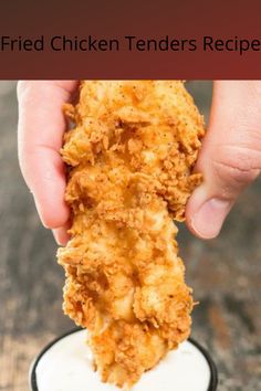 a person is holding some fried food in their hand and it looks like they are about to eat something