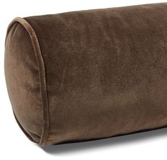 a large brown pillow sitting on top of a white floor