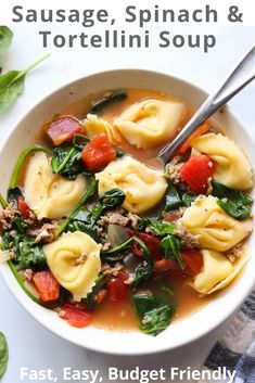 a bowl of tortellini soup with spinach, sausage, spinach and tomato