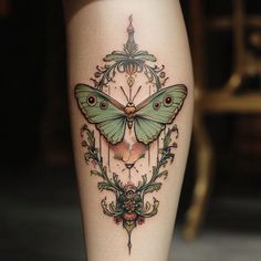 a small butterfly tattoo on the leg