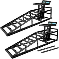 three black metal racks with electronic controls on each one and two separate stands for the same item