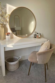 a white desk with a mirror and chair