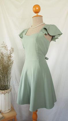 Casual Sage Green Dress, Sage Green Grade 8 Grad Dress, Sage Green Prom Dress Short, Yr 6 Graduation Dresses, Yr 10 Formal Dresses, Green Ruffled Mini Dress For Wedding, Fitted Square Neck Bridesmaid Dress, Elegant Fitted Fairy Dress For Garden Party, Green Sleeveless Fitted Fairy Dress