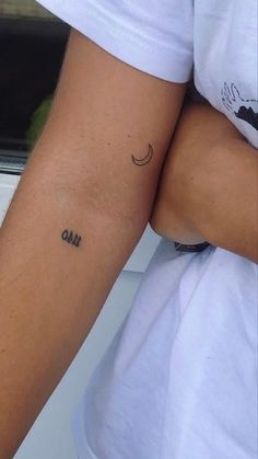 a person with a small tattoo on their arm