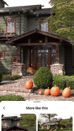 a house with pumpkins in the front yard