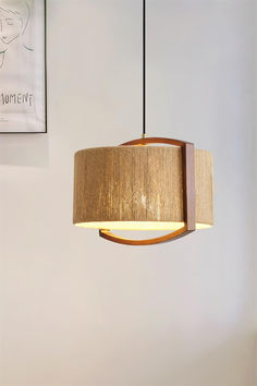 a wooden light fixture hanging from a ceiling