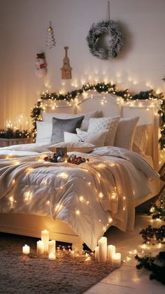 a bedroom decorated for christmas with lights on the bed