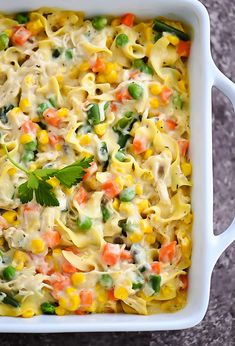 a casserole dish filled with pasta and vegetables