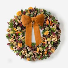 a wreath with an orange bow on it