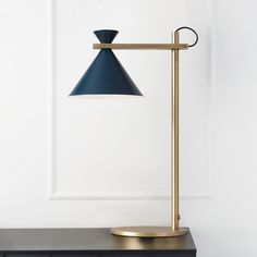 a black and gold lamp on a table