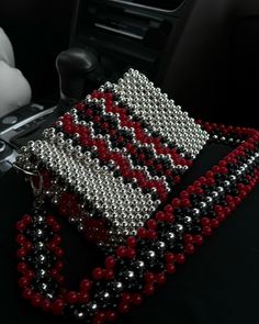 a car dashboard with beads and chains on it