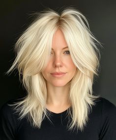 Add texture to your platinum blonde shag with feathered layers for a more dynamic and edgy style. The textured layers create a bold and modern look that’s perfect for those who want to stand out. Feathered Layers, Shag Cut, Blonde Hair Transformations