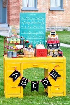 a yellow table with some decorations on it