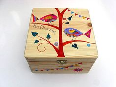 a wooden box with colorful birds painted on it's sides and the words katthene