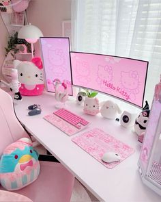 a white desk topped with two computer monitors next to a pink chair and other items