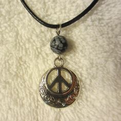 "Peace Sign Necklace -- Single Bead Minimalist Style Single 8mm Bead -- Choose from the List All Real Stone: Amethyst, Turquoise, Smoky Quartz, Malachite, Hematite, Leopard Skin Jasper, Snow Flake Obsidian, Natural Tiger Eye The overall length is adjustable, approximately 18.25\"-19.75\" range, the charm is 3/4\" dia and the overall drop is about 1.5\" -- I made this with silver tone metal alloy hardware, findings, bead, and charm -- The necklace cable is black 2mm dia. with crimped end connecto Adjustable Round Hippie Jewelry, Adjustable Round Charm Necklace Nickel Free, Adjustable Nickel-free Round Charm Necklace, Adjustable Hypoallergenic Round Charm Necklace, Casual Adjustable Necklace With Round Pendant, Casual Adjustable Jewelry With Round Pendant, Adjustable Round Choker For Festivals, Casual Adjustable Round Pendant Necklace, Adjustable Spiritual Jewelry With Peace Sign