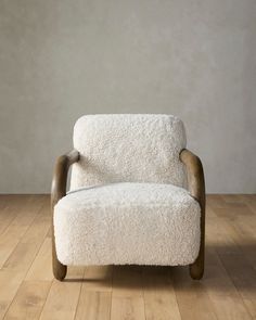 a white chair sitting on top of a wooden floor