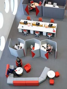 an office cubicle with people working at desks