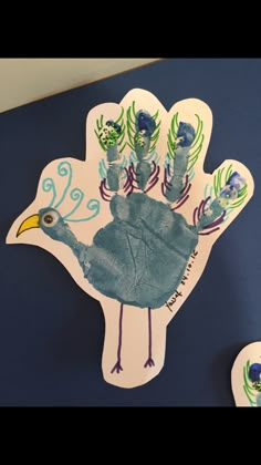 a handprinted turkey is displayed on a blue background