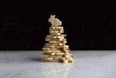 a stack of wooden pieces sitting on top of a white counter