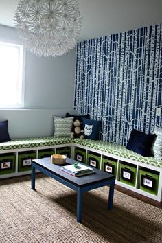 a living room with blue and green wallpaper